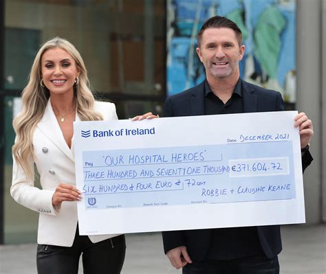 Robbie and Claudine Keane present huge cheque from Hospital 